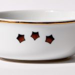 Detail view of back of shaving bowl with illustration of vintage stylized American flag stars