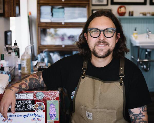 Portrait of illustrator Laurent Trelaun in his tattoo studio, the artist behind Brousseau & Dov’s inaugural shaving bowl designs