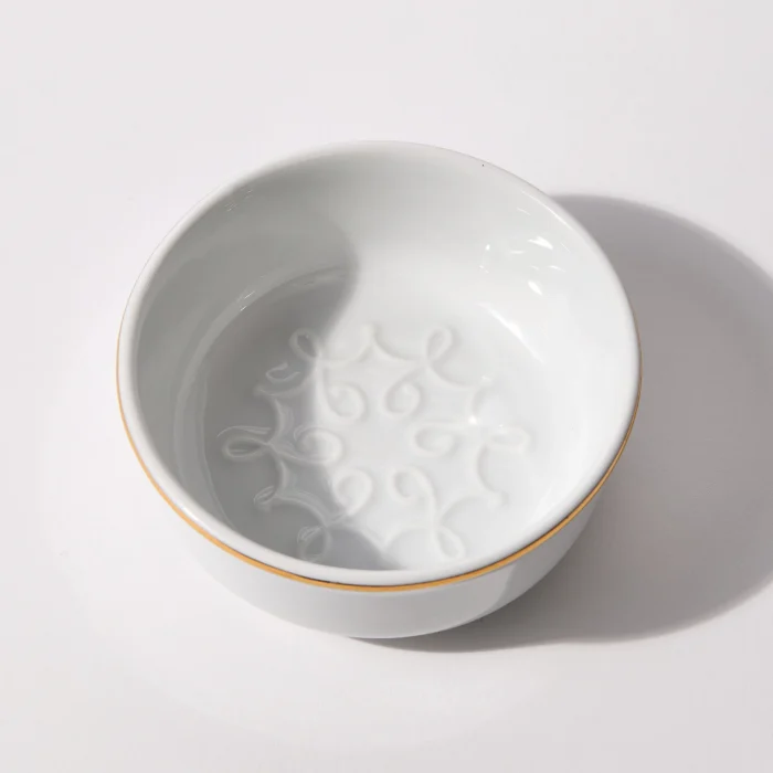 Top-down view of shaving bowl interior showing lather feature and smooth glazed surface