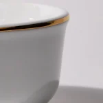 Close-up of the Founder’s Edition porcelain shaving bowl showing the smooth 24K gold rim and fine glaze detail.