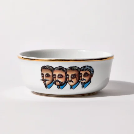 Porcelain shaving bowl with illustration of Victorian-era gentlemen portraits, gold trim