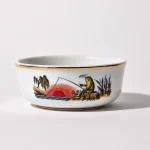 Porcelain shaving bowl with illustration of anthropomorphic frog fishing and riverside backdrop, gold trim