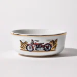 Porcelain shaving bowl with illustration of vintage Harley-Davidson motorcycle and desert backdrop, gold trim