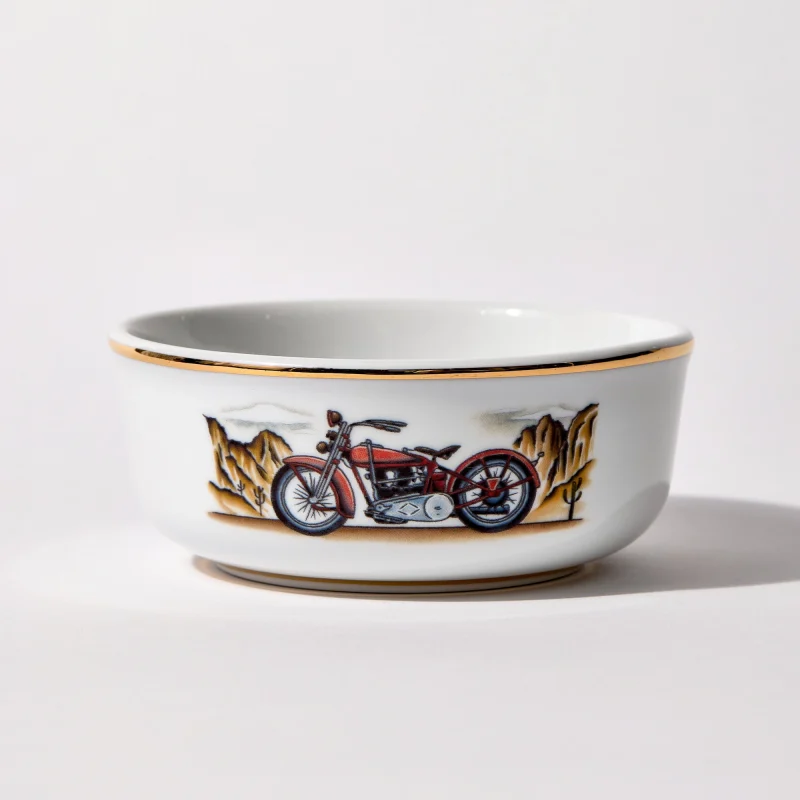 Porcelain shaving bowl with illustration of vintage Harley-Davidson motorcycle and desert backdrop, gold trim