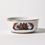 Porcelain shaving bowl with illustration of vintage sailing ship and port backdrop, gold trim