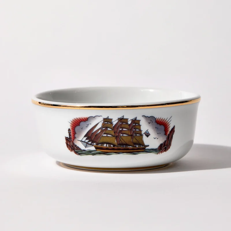 Porcelain shaving bowl with illustration of vintage sailing ship and port backdrop, gold trim